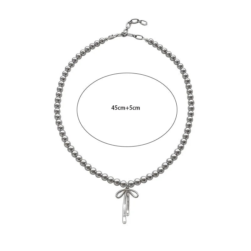 Collier ras du cou et boucles d'oreilles vintage en perles avec nœud papillon